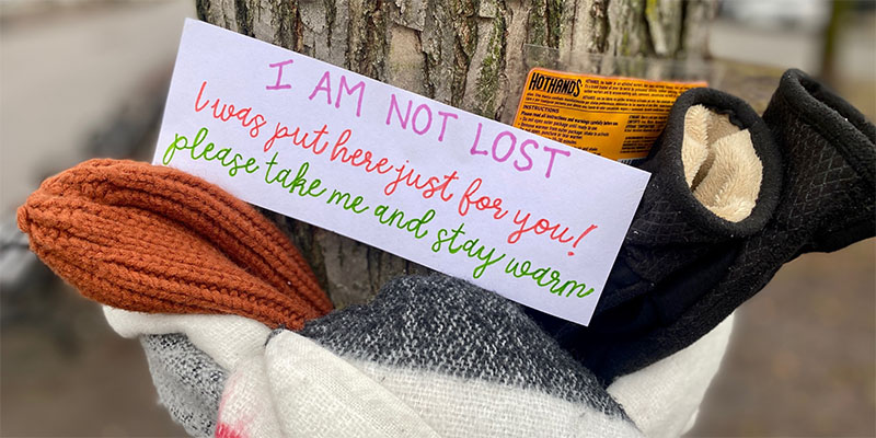 Scarves and Mittens attached to tree